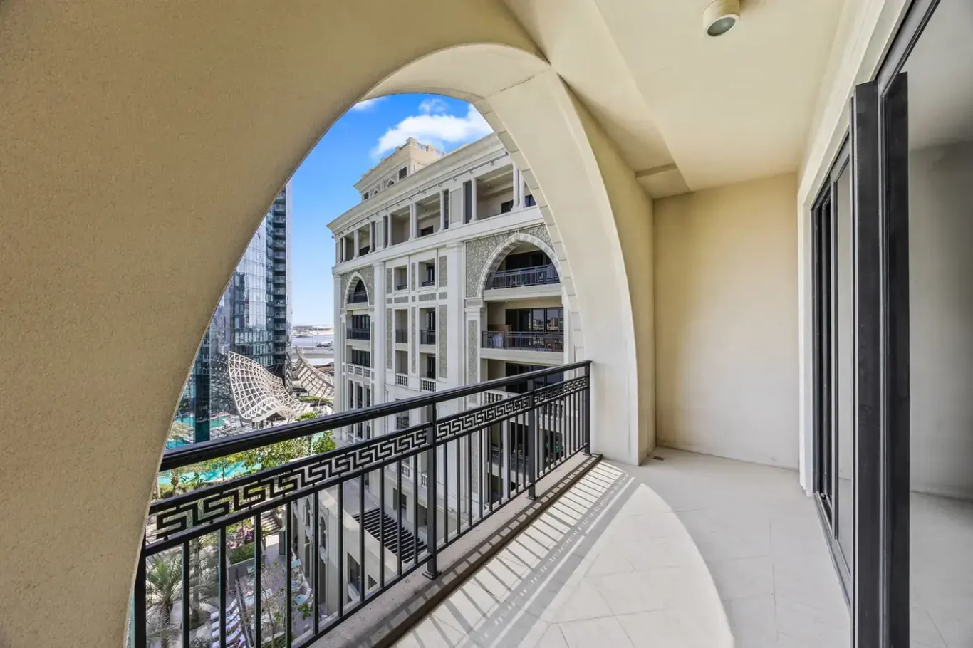 Balcony view of the Palazzo Versace facade in a three-bedroom residence at Palazzo Versace Dubai, Jaddaf Waterfront, photographed for Concierge Auctions.