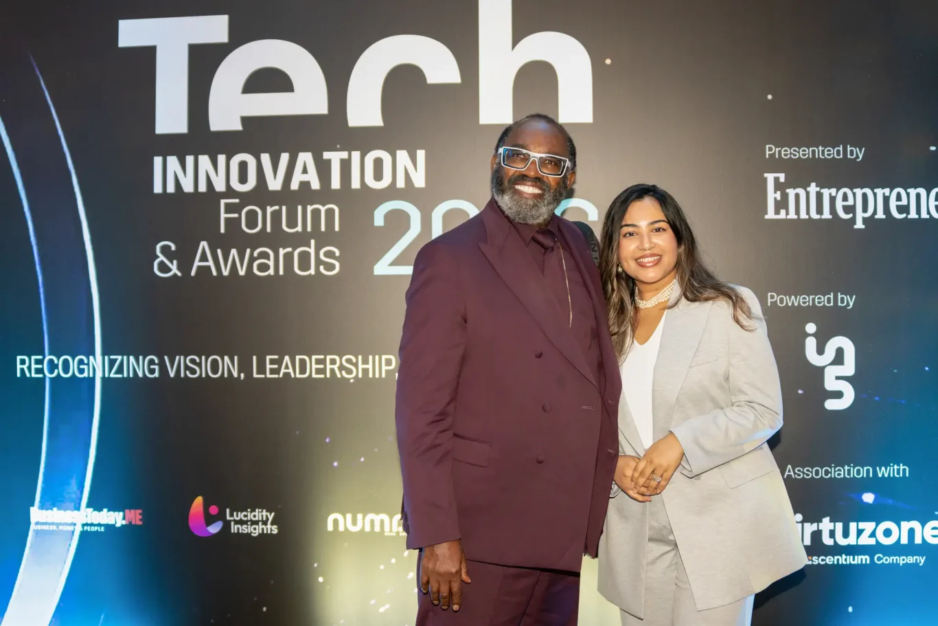 Two guests photographed together at the awards backdrop. Event photography by MRPS for FundedNext at the Tech Innovation Awards 2026, Al Habtoor Palace, Dubai.