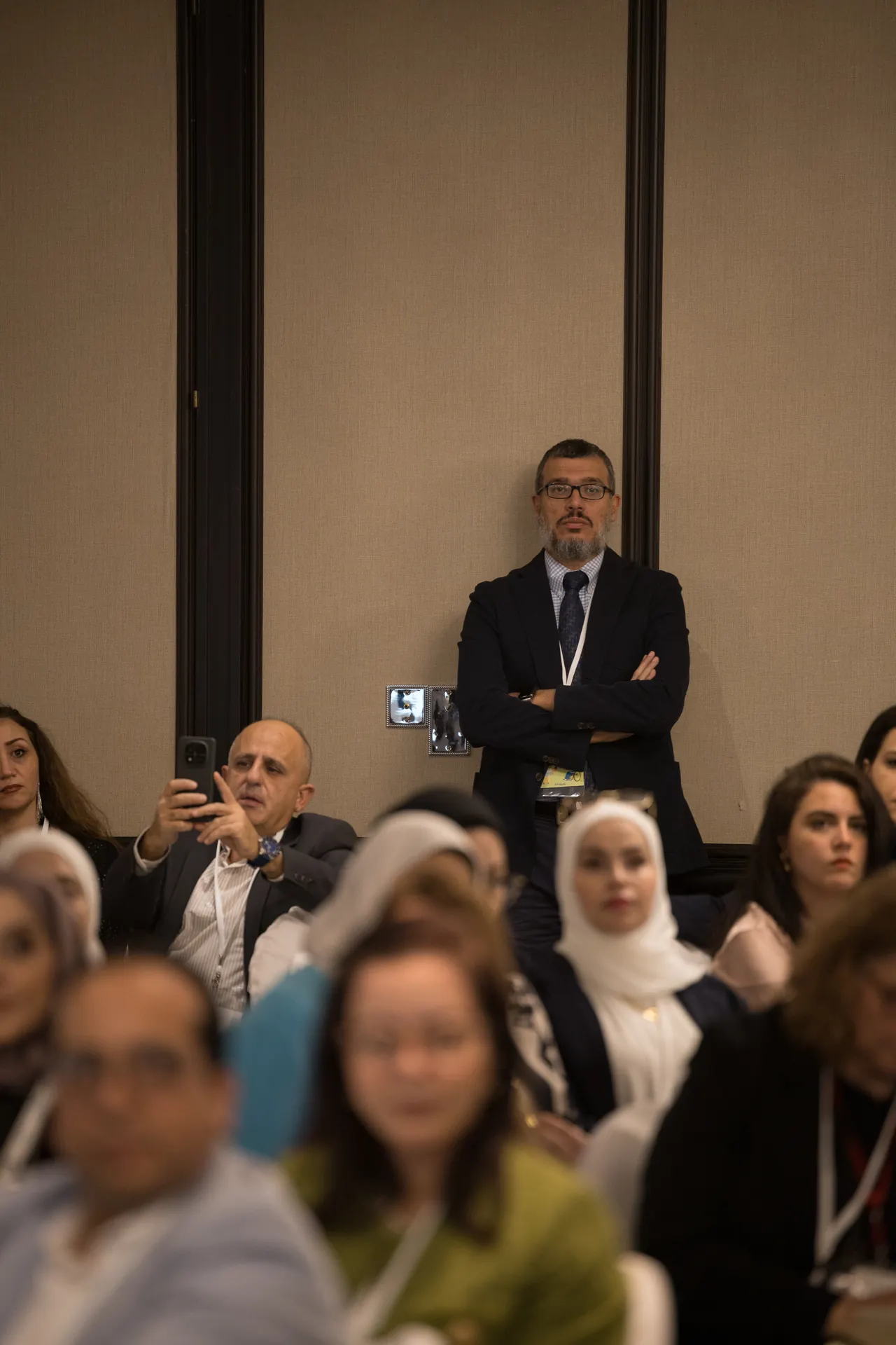 Audience members at their tables during a question and answer session. Corporate event photography by MRPS for My Arabic Publishing at Movenpick Grand Al Bustan, Dubai.