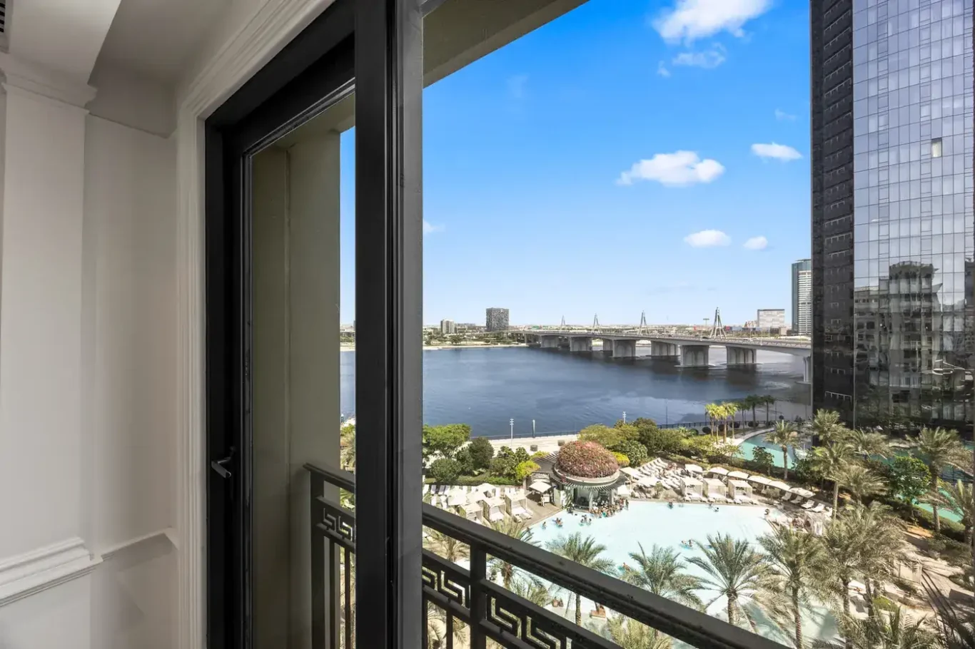 Bedroom balcony with Dubai Creek and pool view in a three-bedroom residence at Palazzo Versace Dubai, Jaddaf Waterfront, photographed for Concierge Auctions.