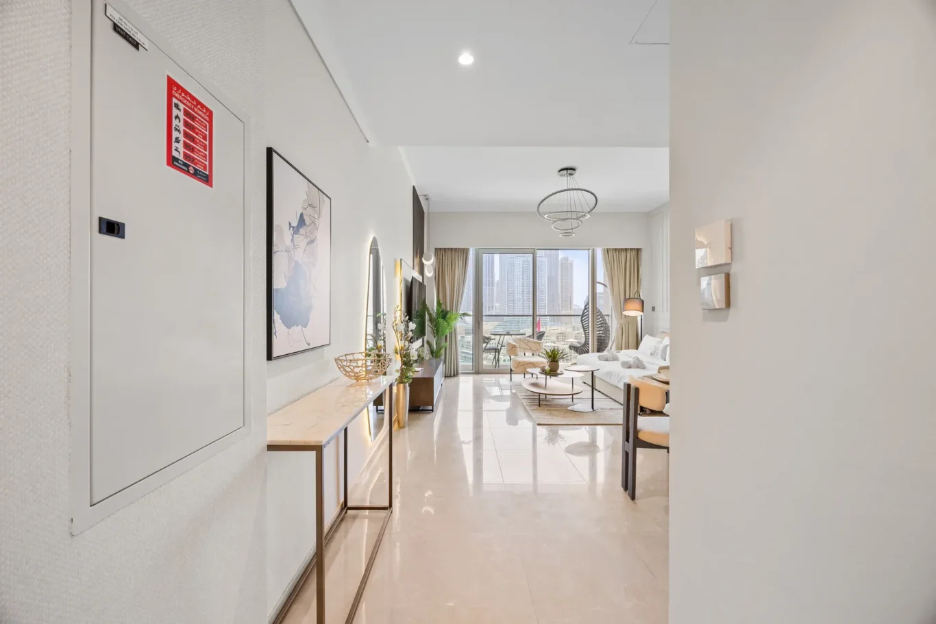 Entrance hallway to living room in a two-bedroom StayComfy Holiday Homes apartment at Grande Signature, Downtown Dubai.