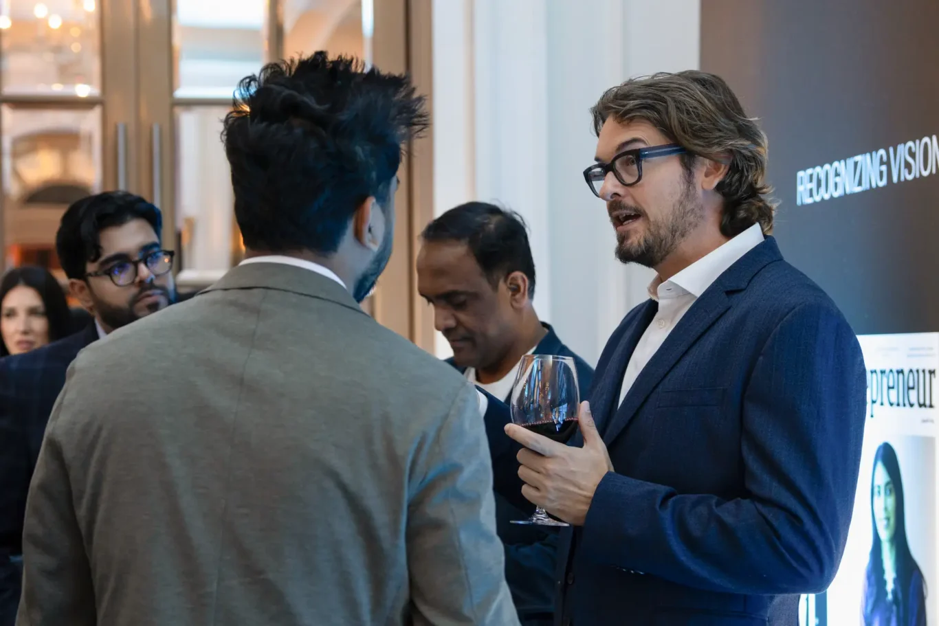 Conversation between guests at the reception. Event photography by MRPS for FundedNext at the Tech Innovation Awards 2026, Al Habtoor Palace, Dubai.