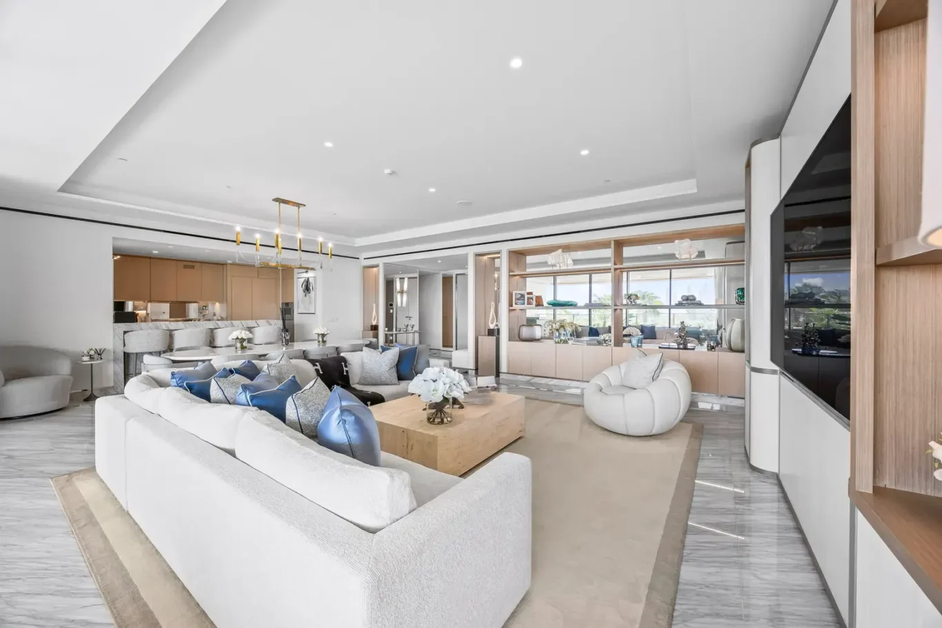 Open plan living and dining area in a furnished three-bedroom residence at Atlantis The Royal, Palm Jumeirah, photographed for Apex Homes Real Estate.