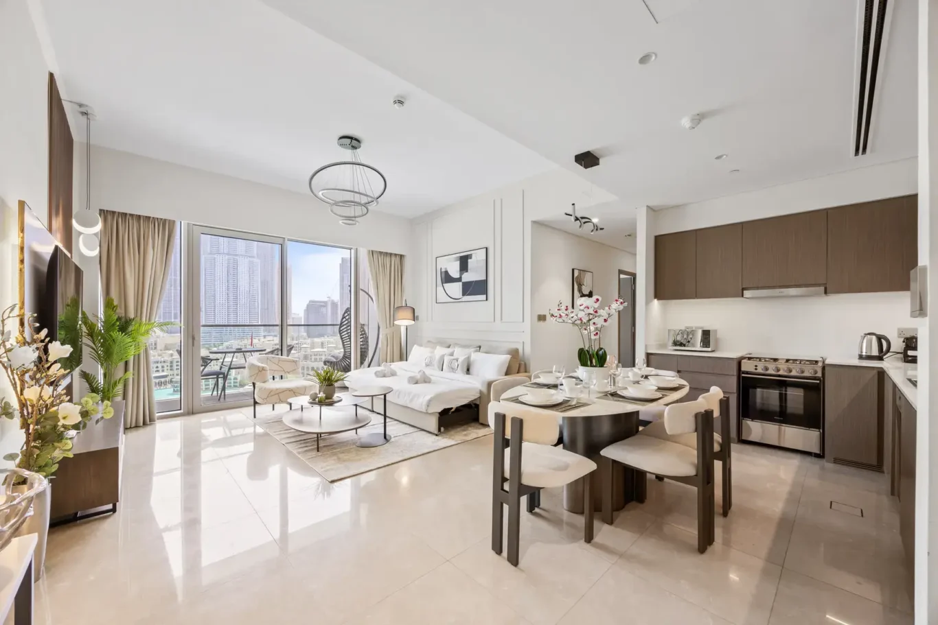 Open plan living and dining area in a two-bedroom StayComfy Holiday Homes apartment at Grande Signature, Downtown Dubai.