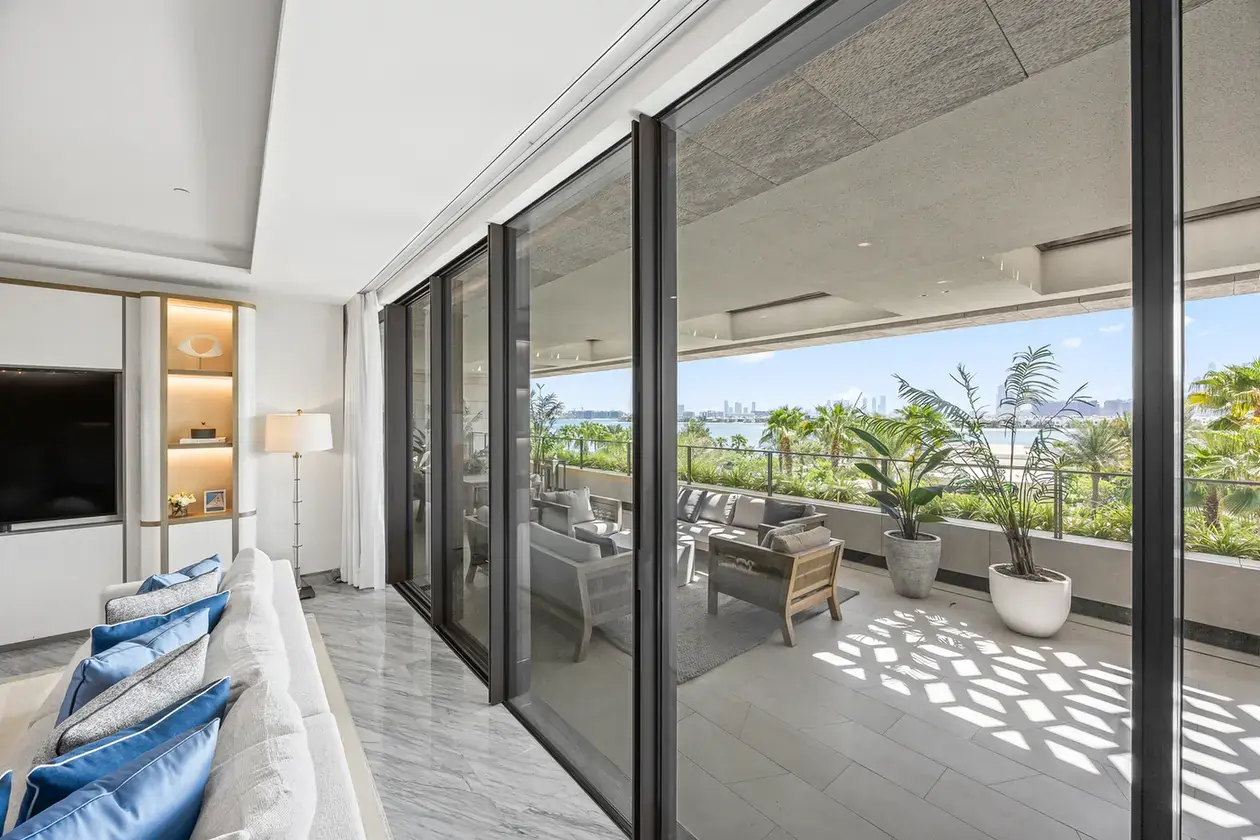 Living room opening onto the terrace in a furnished three-bedroom residence at Atlantis The Royal, Palm Jumeirah, photographed for Apex Homes Real Estate.