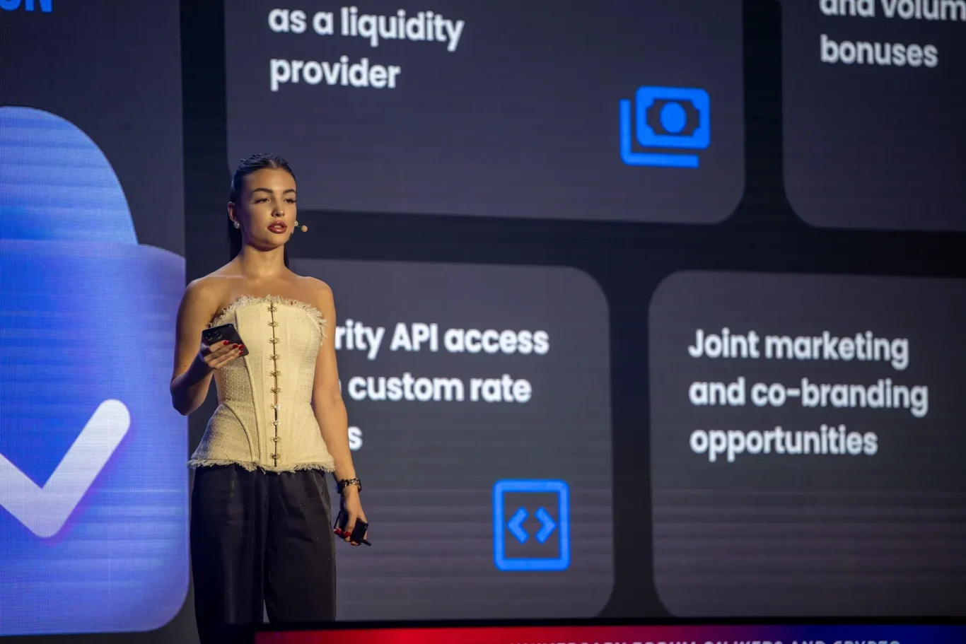 Presenter explaining a product on the main stage. Event photography by MRPS at Blockchain Life 2025, Festival Arena, Dubai.