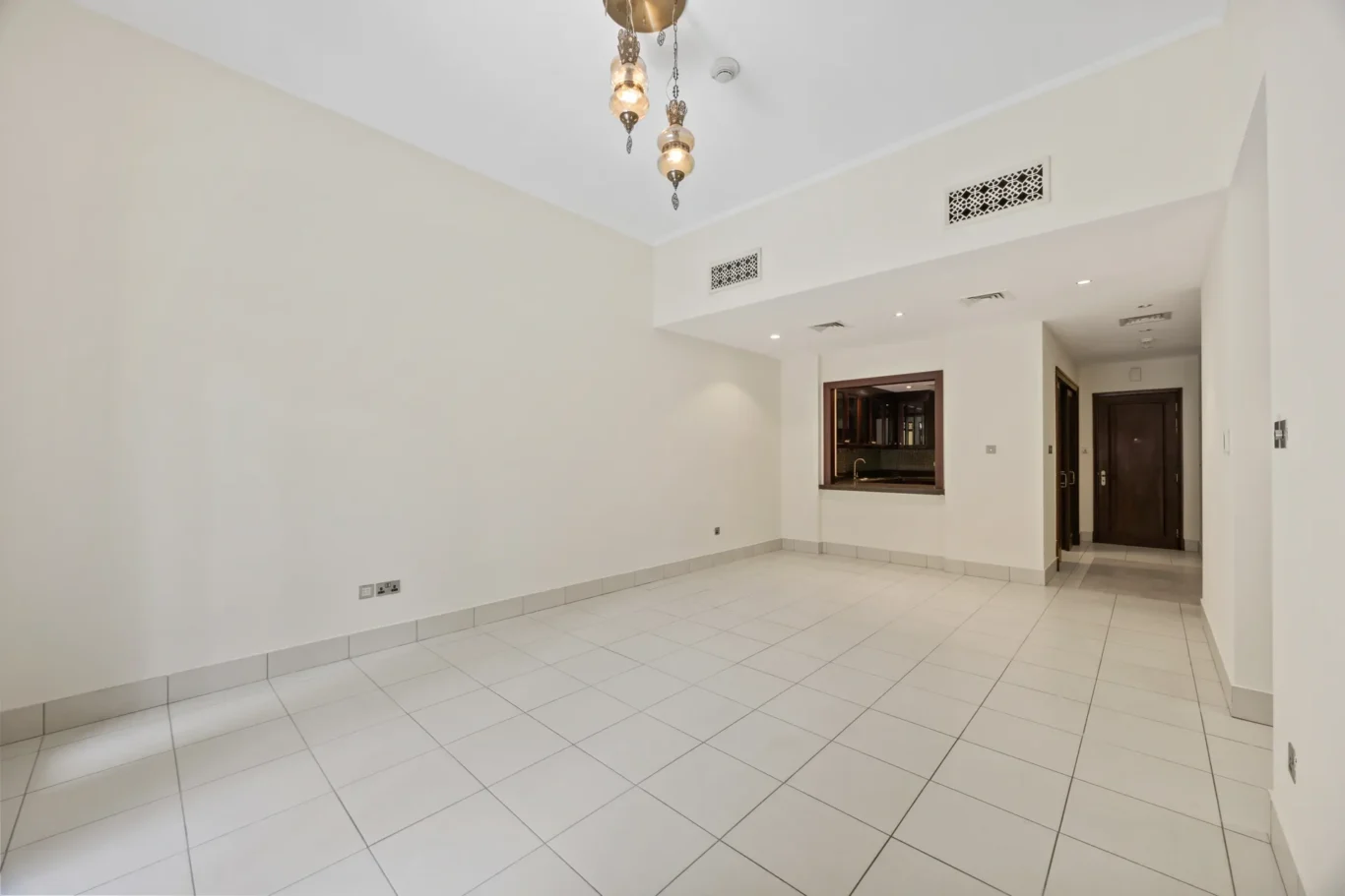 Reception room with lantern pendant light in an unfurnished two-bedroom garden apartment in Old Town, Downtown Dubai, photographed for ELITE Property Brokerage.