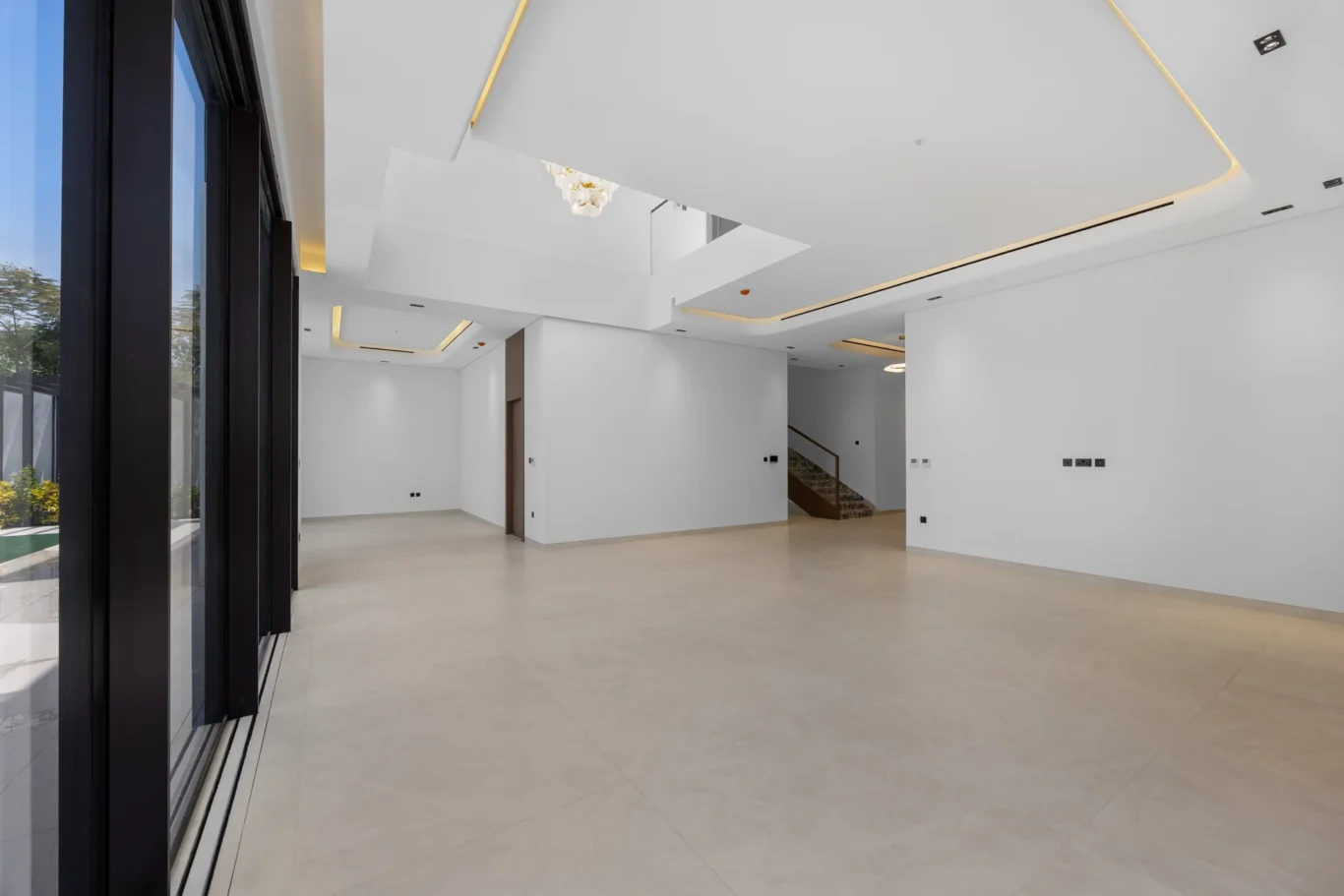 Living area seen from the terrace doors, unfurnished five-bedroom villa in Al Furjan, Dubai.