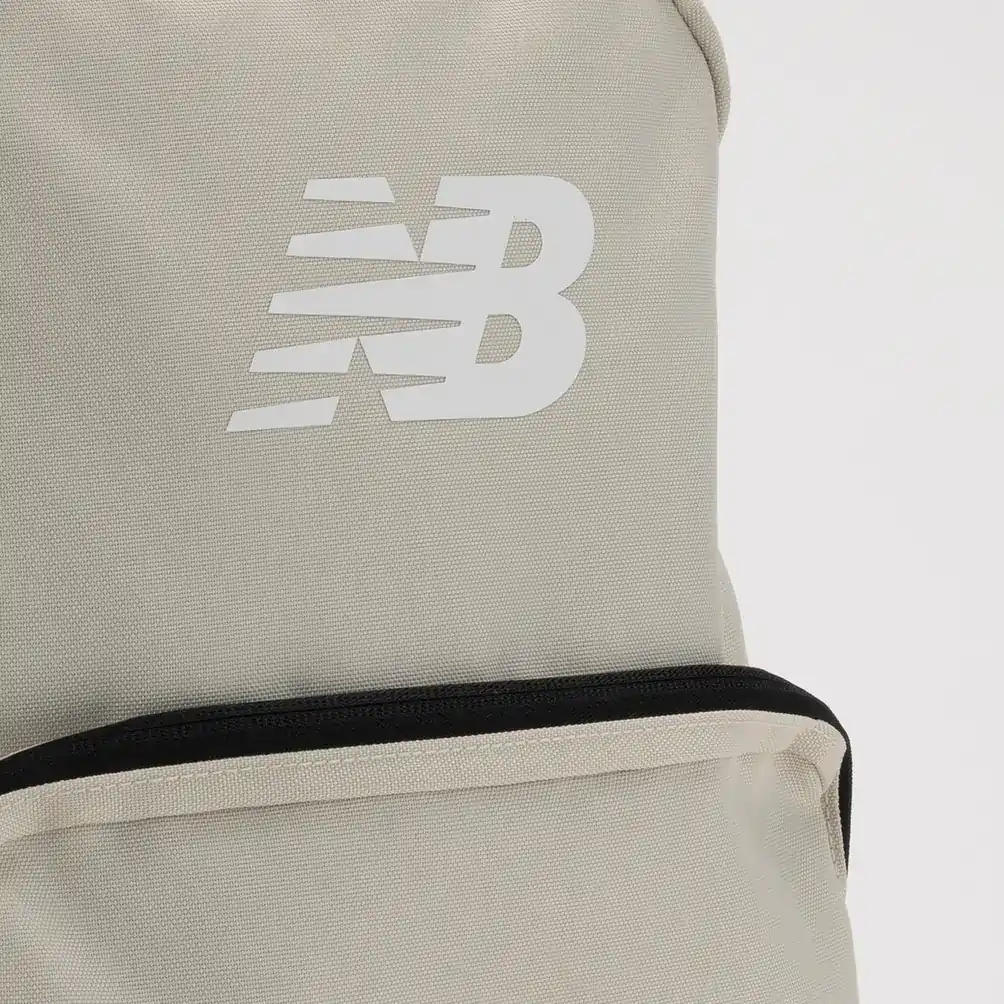 Close-up of the white NB logo on the stone New Balance backpack. E-commerce product photography for New Balance by MRPS in Dubai.