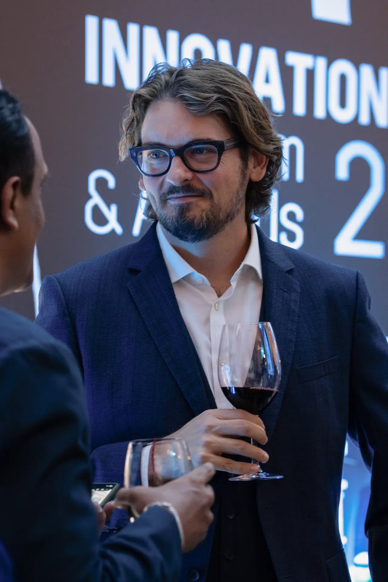 Candid portrait of a guest at the reception. Event photography by MRPS for FundedNext at the Tech Innovation Awards 2026, Al Habtoor Palace, Dubai.