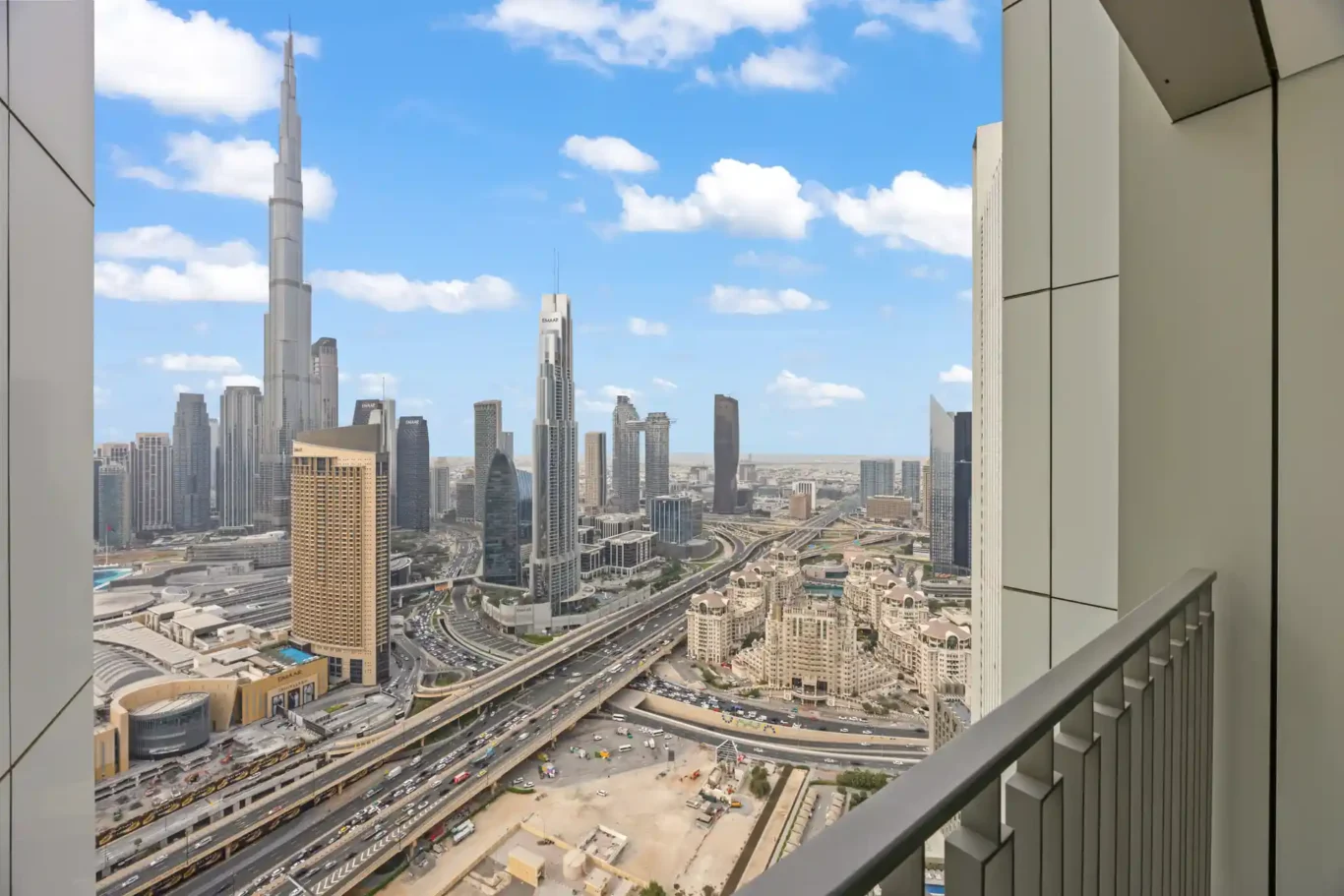 Burj Khalifa and the Downtown Dubai skyline seen from the balcony in daylight. Day, twilight and night Airbnb photography by MRPS for Vista Haus Holiday Homes in Downtown Dubai.