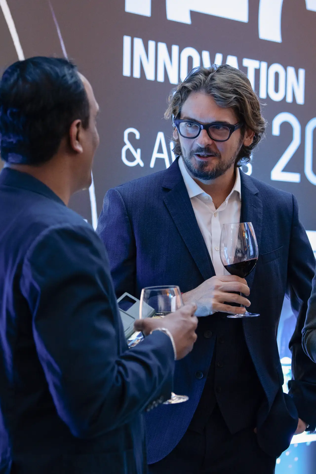 Candid conversation during the reception. Event photography by MRPS for FundedNext at the Tech Innovation Awards 2026, Al Habtoor Palace, Dubai.
