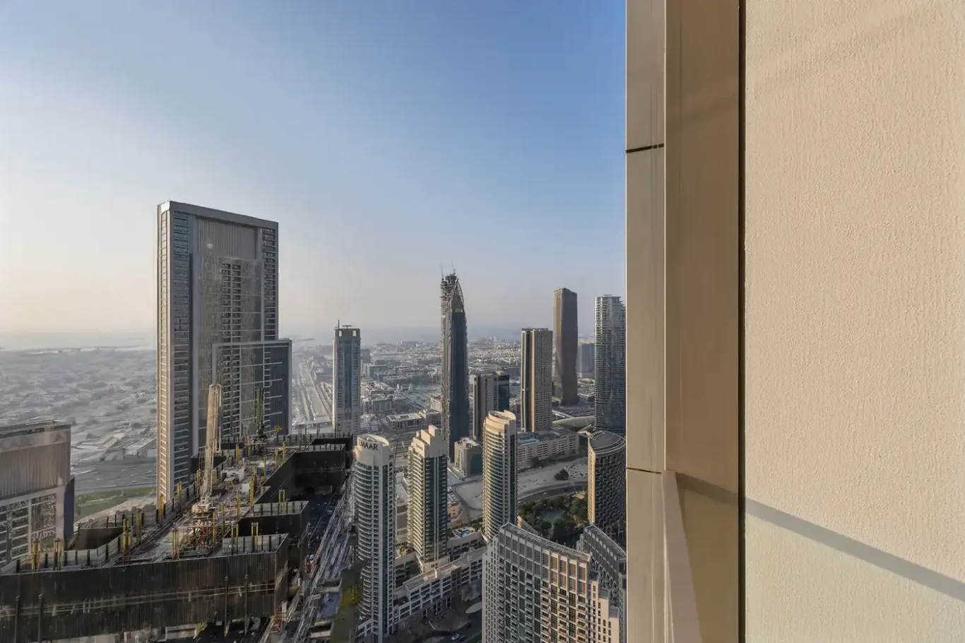 Panoramic view of Downtown Dubai from the high floor apartment. Airbnb photography by MRPS for Solea Stay in Dubai.