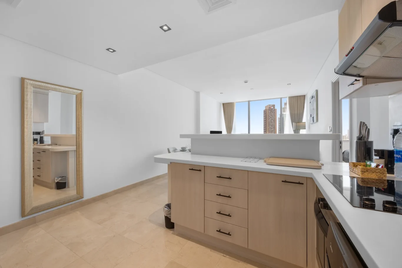 Kitchen counter and full-length mirror in a Your Stay Apartments one-bedroom at Sky Gardens, DIFC, Dubai.