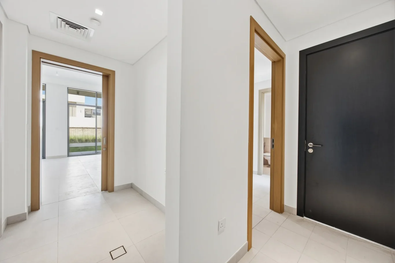 Kitchen counter, sink and window with garden light. Villa photography by MRPS in Dubai for ELITE Property Brokerage.