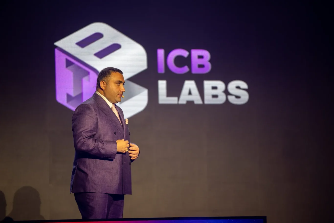 Sponsor keynote on stage with a large brand screen. Event photography by MRPS at Blockchain Life 2025, Festival Arena, Dubai.