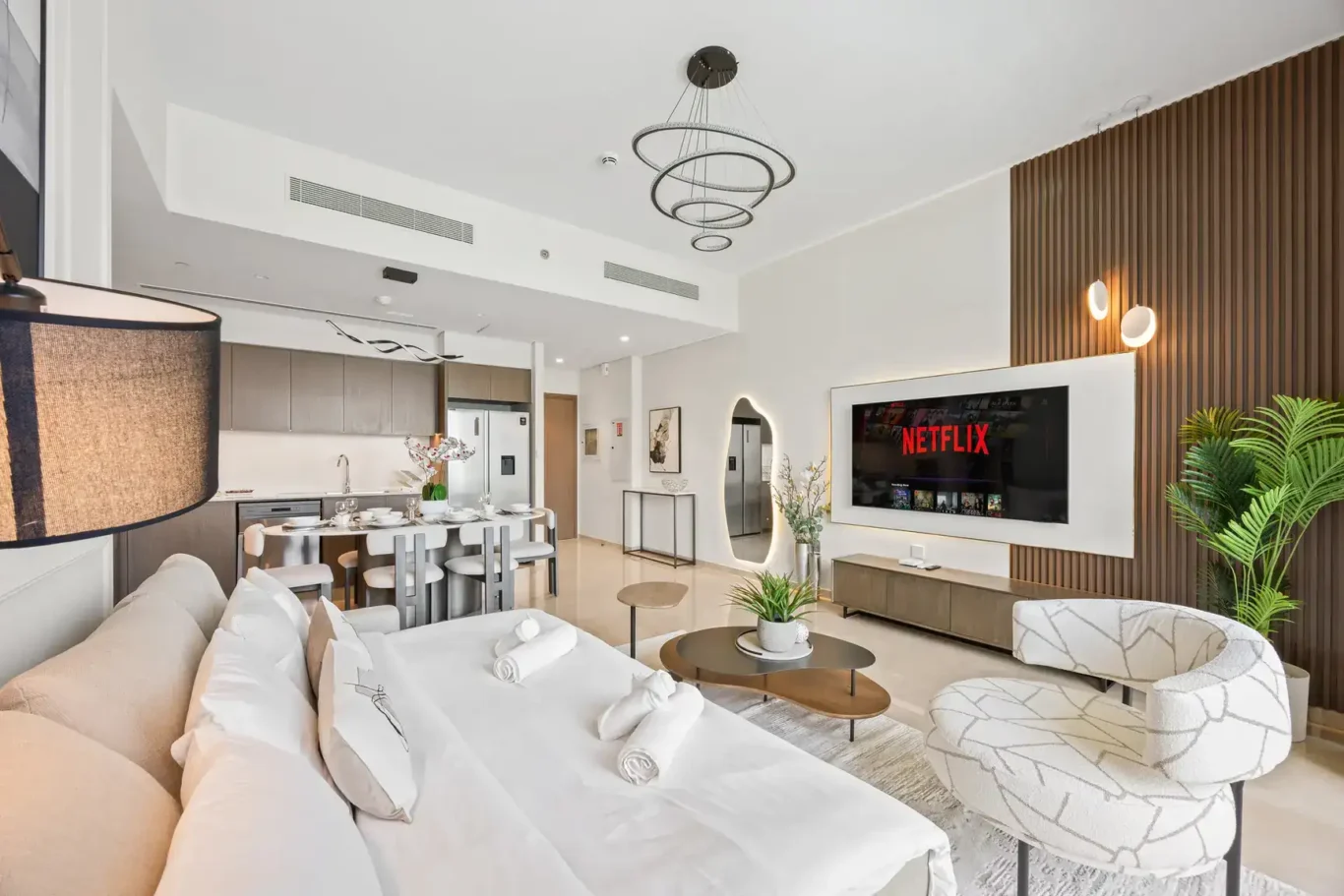 Lounge and open kitchen in a two-bedroom StayComfy Holiday Homes apartment at Grande Signature, Downtown Dubai.