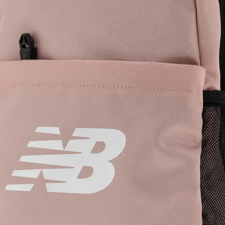 Close-up of the NB logo and front pocket on the pink New Balance backpack. E-commerce product photography for New Balance by MRPS in Dubai.