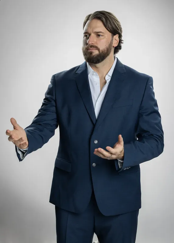 Presenting gesture with both hands open. White background reference photo from an AI model training photoshoot at the MRPS studio in Dubai.