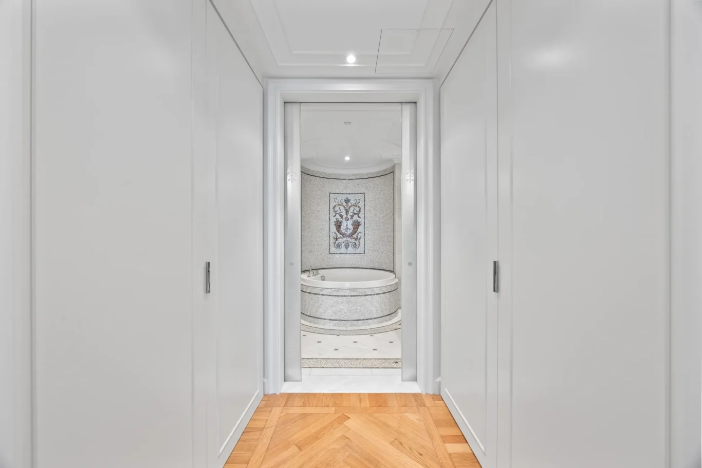 Walk-in wardrobe leading to the master bathroom in a three-bedroom residence at Palazzo Versace Dubai, Jaddaf Waterfront, photographed for Concierge Auctions.