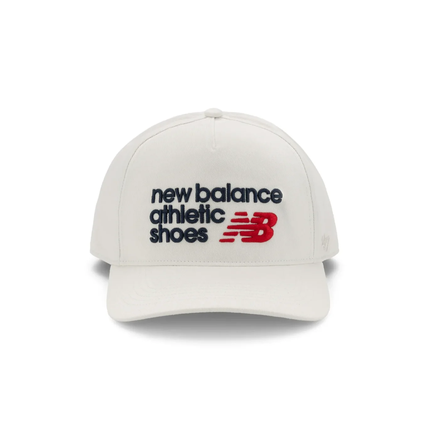 White New Balance cap with navy and red athletic shoes logo, front view. E-commerce product photography for New Balance by MRPS in Dubai.