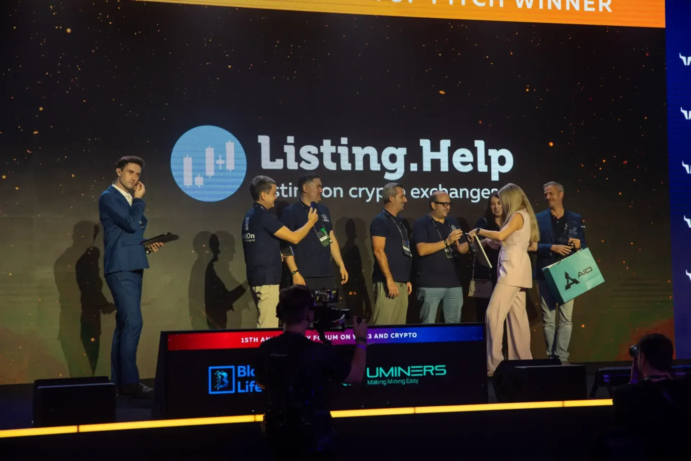 Winners celebrating on stage at the startup awards. Event photography by MRPS at Blockchain Life 2025, Festival Arena, Dubai.