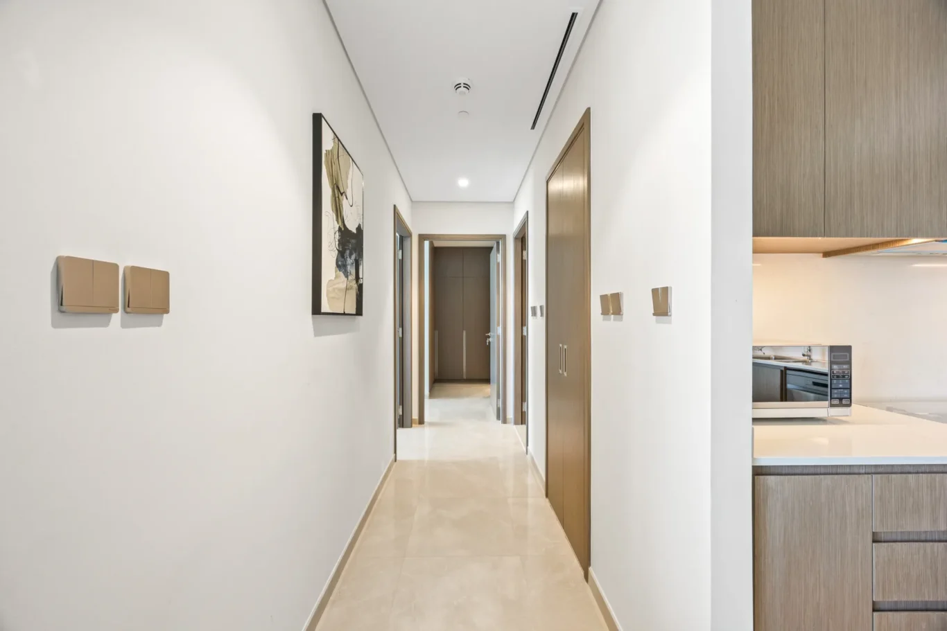 Entrance corridor in a two-bedroom StayComfy Holiday Homes apartment at Grande Signature, Downtown Dubai.