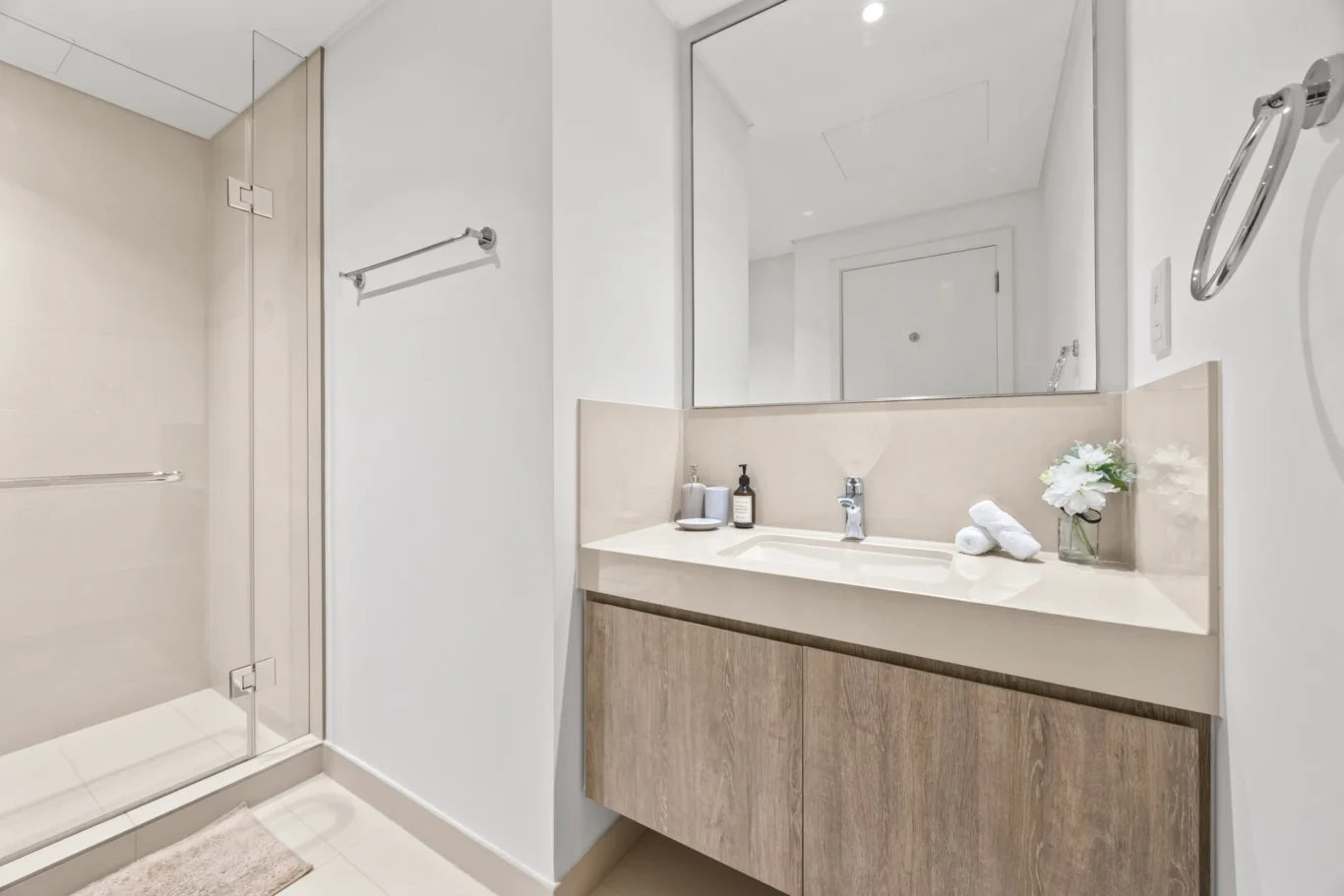 Master ensuite bathroom vanity with mirror and toiletries. Day, twilight and night Airbnb photography by MRPS for Vista Haus Holiday Homes in Downtown Dubai.