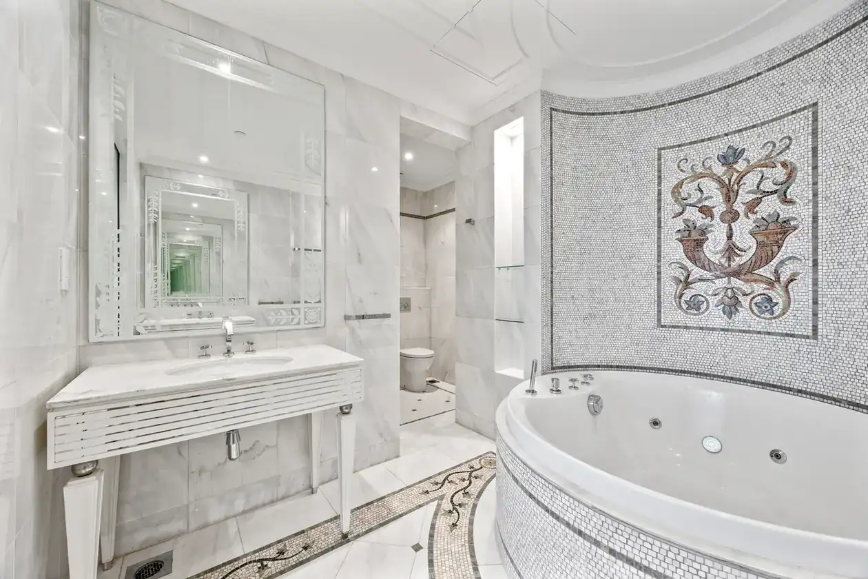 Marble vanity and mosaic panel in the master bathroom in a three-bedroom residence at Palazzo Versace Dubai, Jaddaf Waterfront, photographed for Concierge Auctions.