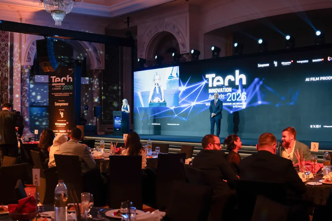 Ballroom during the ceremony with the stage screens lit. Event photography by MRPS for FundedNext at the Tech Innovation Awards 2026, Al Habtoor Palace, Dubai.