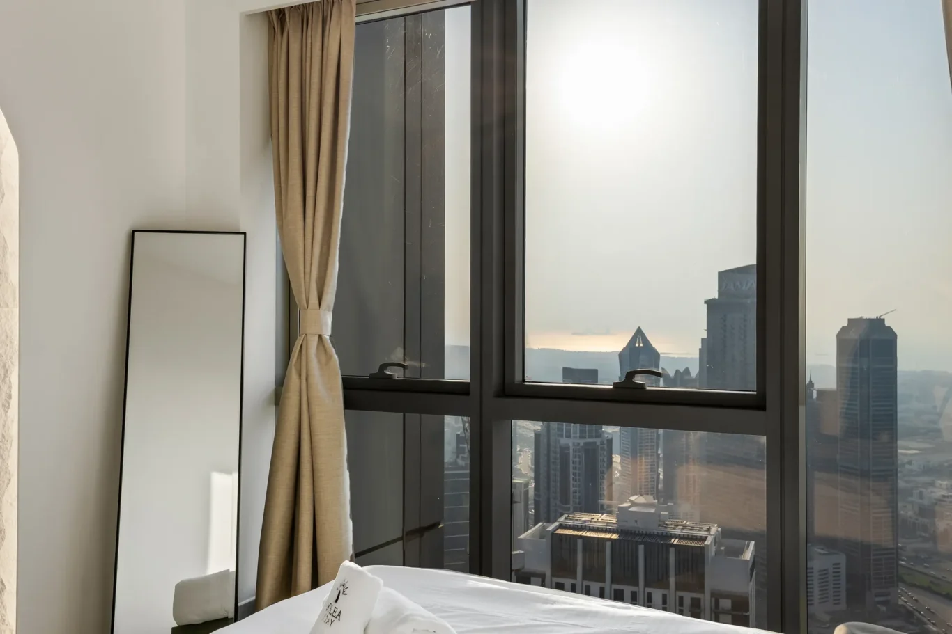 Bedroom window view over Downtown Dubai towers. Airbnb photography by MRPS for Solea Stay in Dubai.