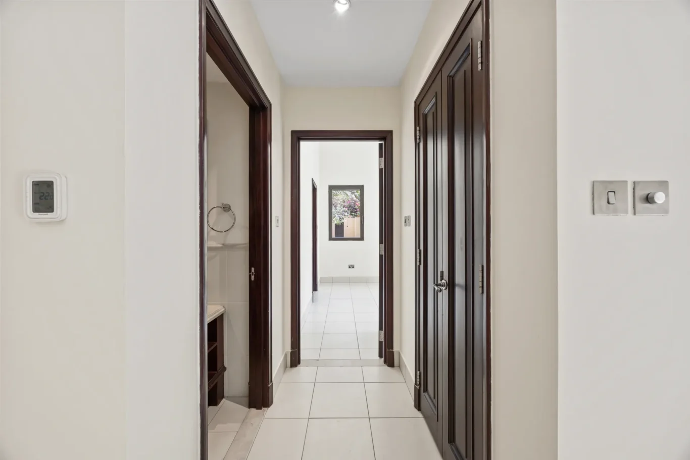Hallway with storage cupboards in an unfurnished two-bedroom garden apartment in Old Town, Downtown Dubai, photographed for ELITE Property Brokerage.