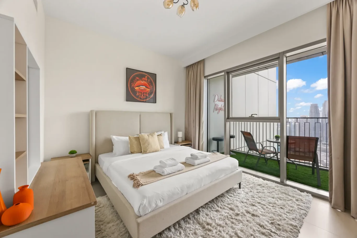 Master bedroom with king bed, grey headboard and balcony door. Day, twilight and night Airbnb photography by MRPS for Vista Haus Holiday Homes in Downtown Dubai.