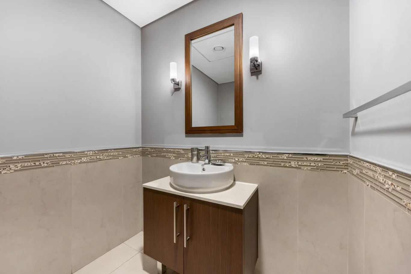 Guest washroom vanity in a Your Stay Apartments one-bedroom at Burj Daman, DIFC, Dubai.