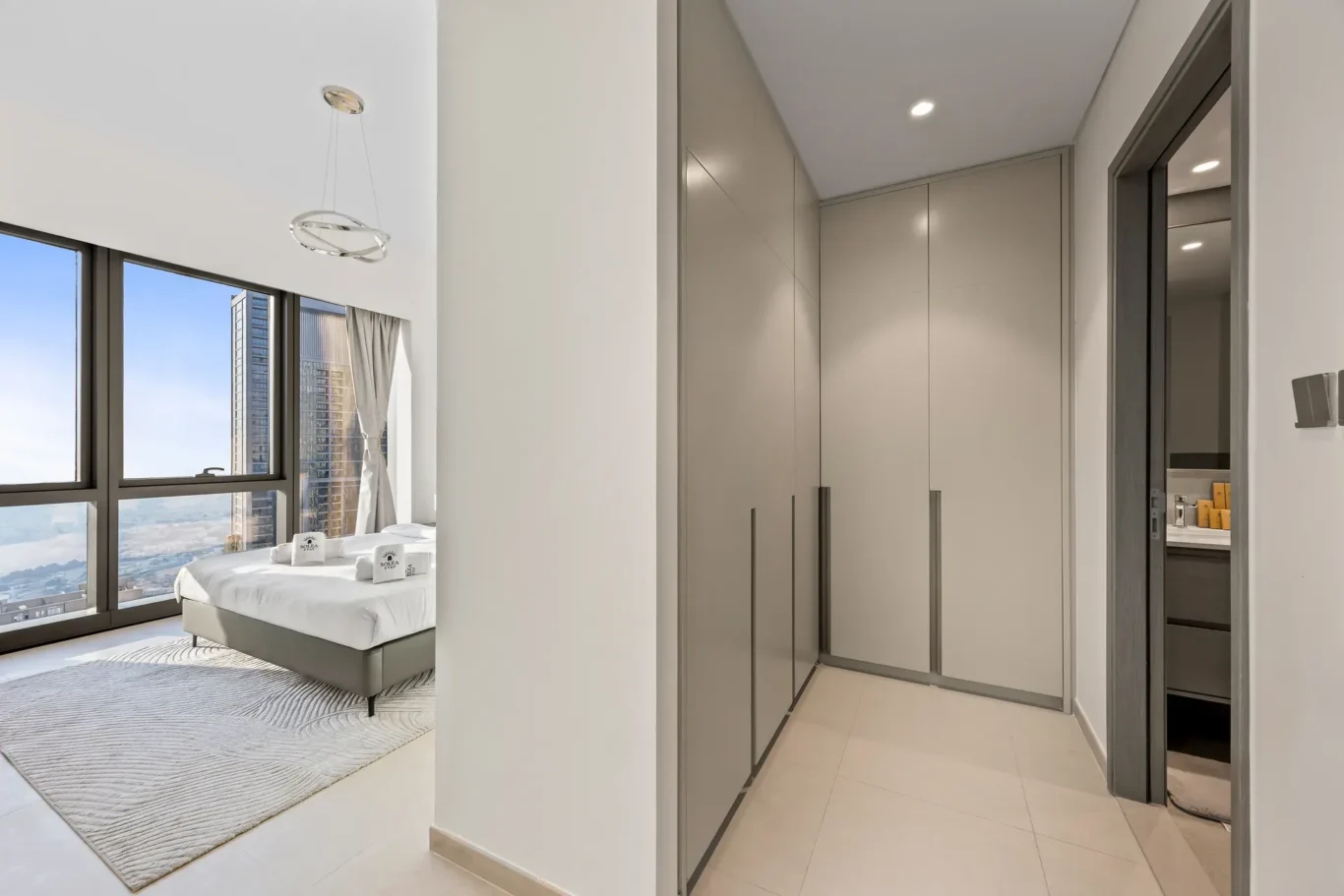 Master bedroom seen past the walk in wardrobe. Airbnb photography by MRPS for Solea Stay in Dubai.
