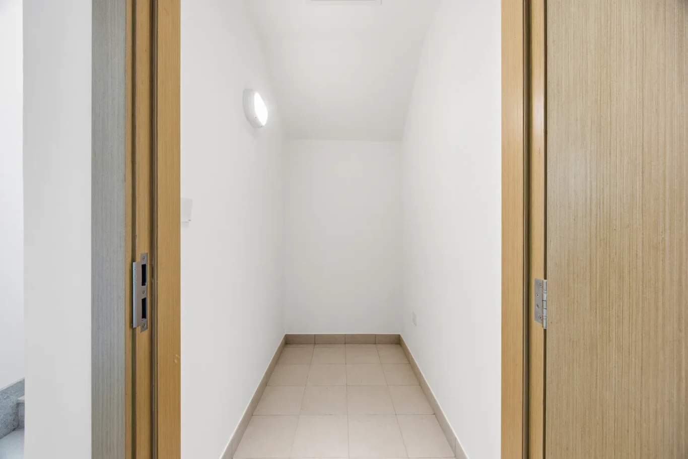 Utility corridor with storage doors. Villa photography by MRPS in Dubai for ELITE Property Brokerage.