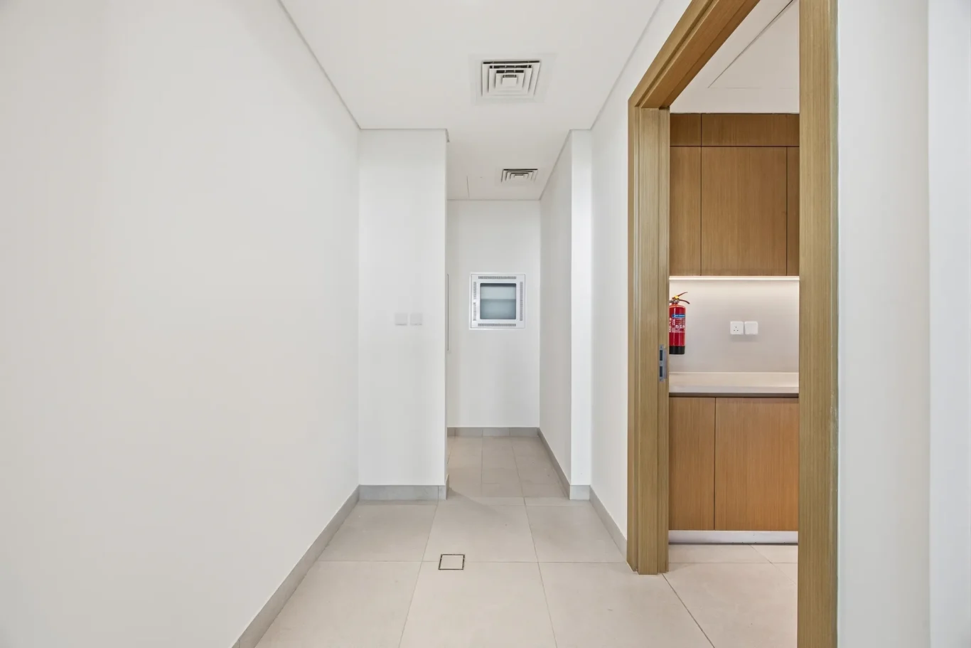 Corridor leading to the rear rooms of the ground floor. Villa photography by MRPS in Dubai for ELITE Property Brokerage.