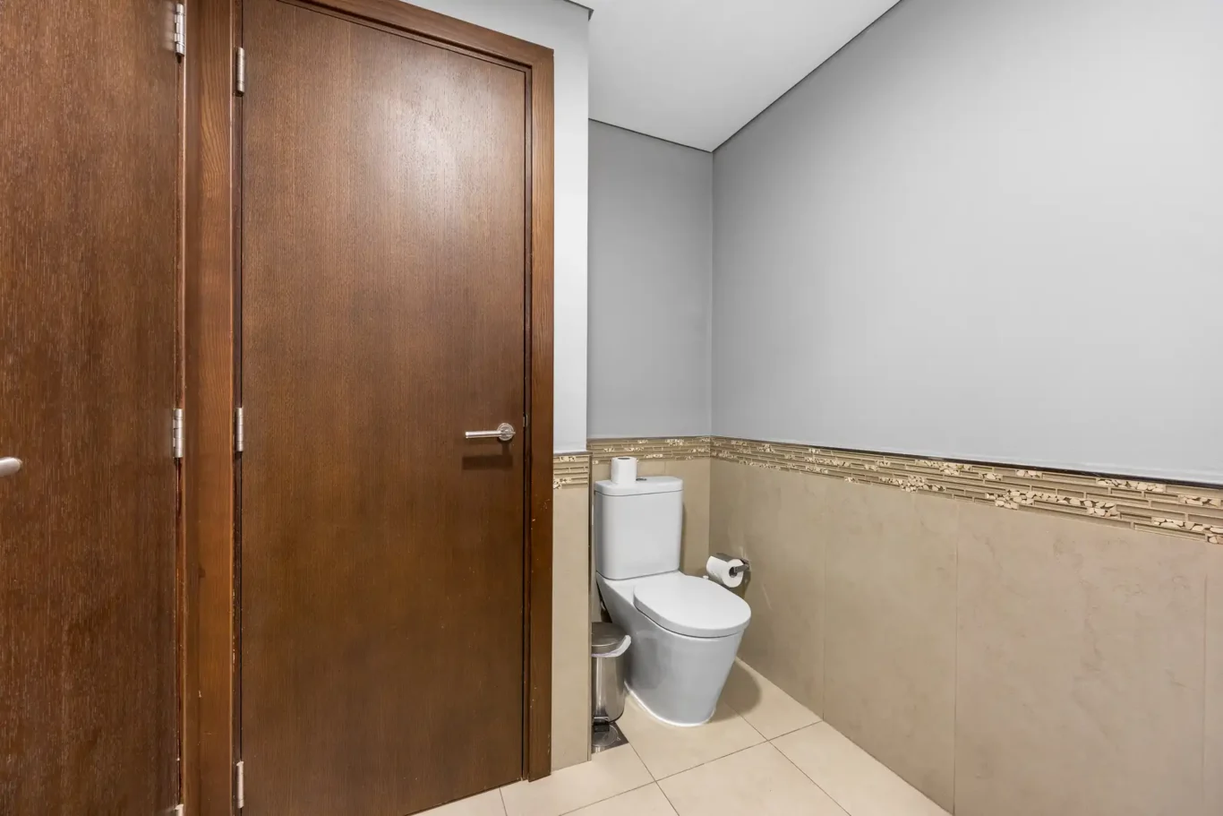 Guest toilet in a Your Stay Apartments one-bedroom at Burj Daman, DIFC, Dubai.
