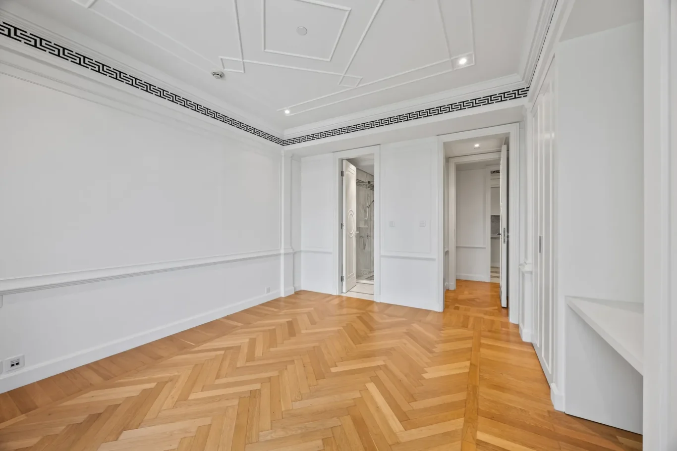 Bedroom with dressing area and parquet floor in a three-bedroom residence at Palazzo Versace Dubai, Jaddaf Waterfront, photographed for Concierge Auctions.