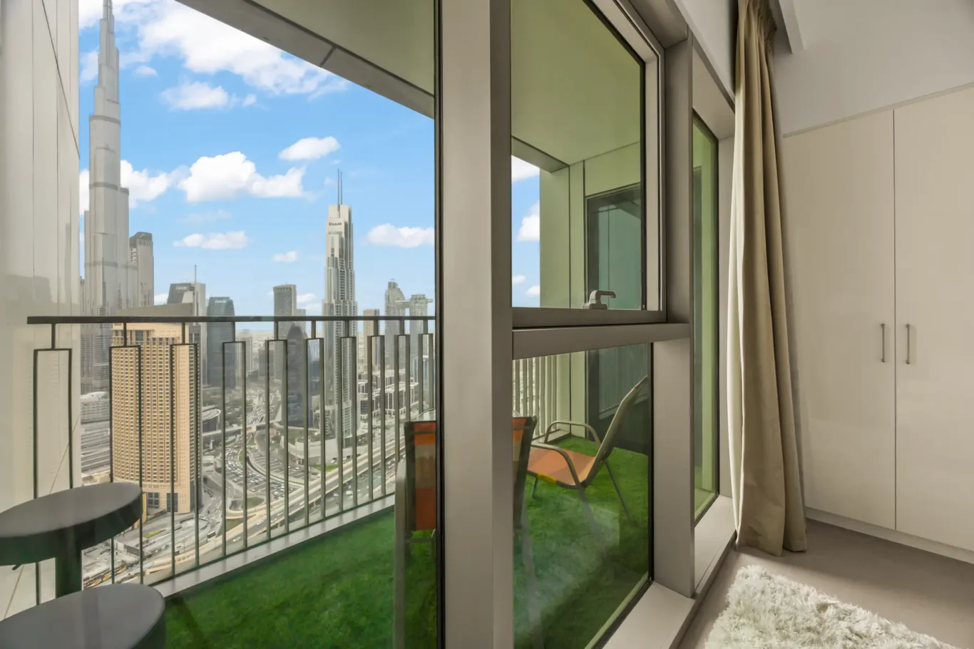 Master bedroom balcony with Burj Khalifa in view. Day, twilight and night Airbnb photography by MRPS for Vista Haus Holiday Homes in Downtown Dubai.