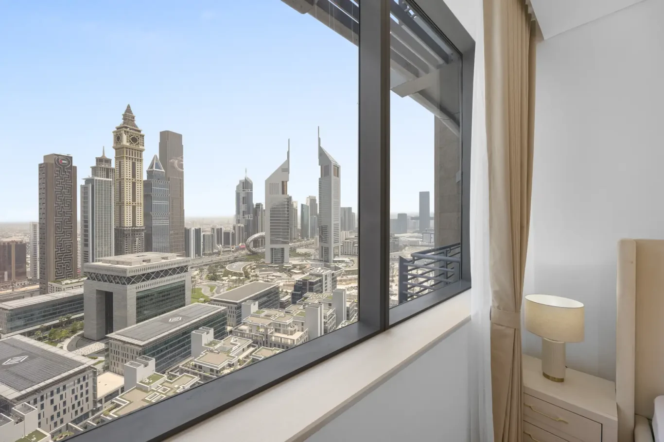 DIFC view from the bedroom window in a Your Stay Apartments one-bedroom at Sky Gardens, DIFC, Dubai.