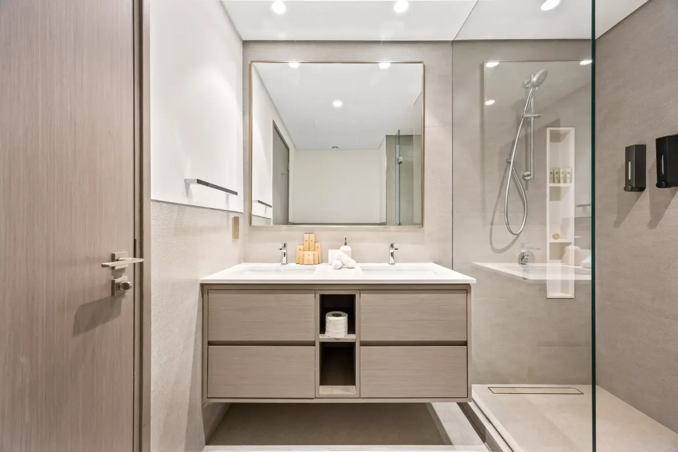 Ensuite bathroom vanity with mirror and walk in shower. Airbnb photography by MRPS for Solea Stay in Dubai.