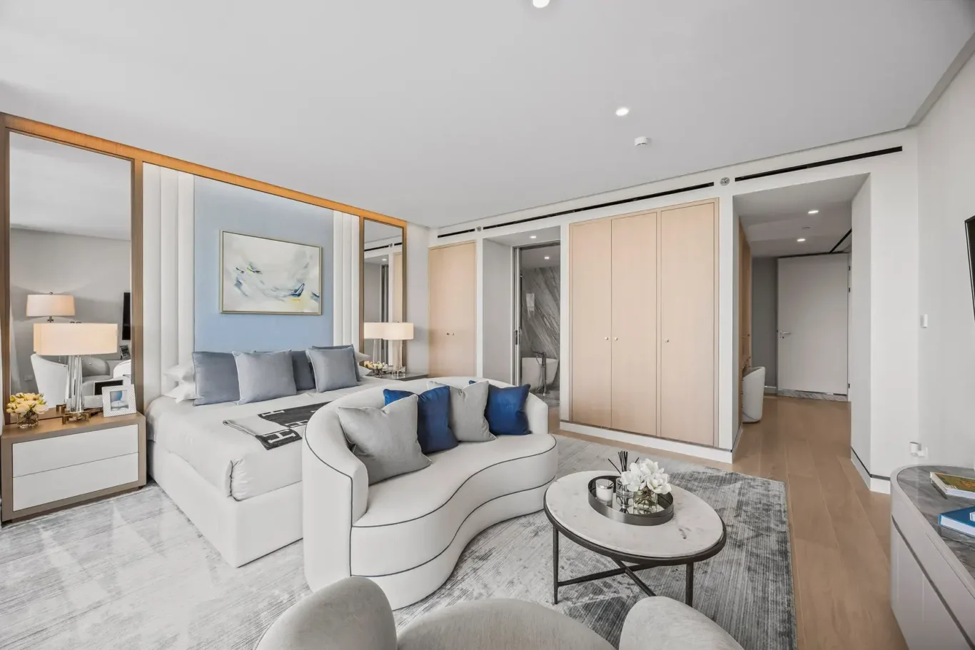 Master suite overview with lounge and bed in a furnished three-bedroom residence at Atlantis The Royal, Palm Jumeirah, photographed for Apex Homes Real Estate.