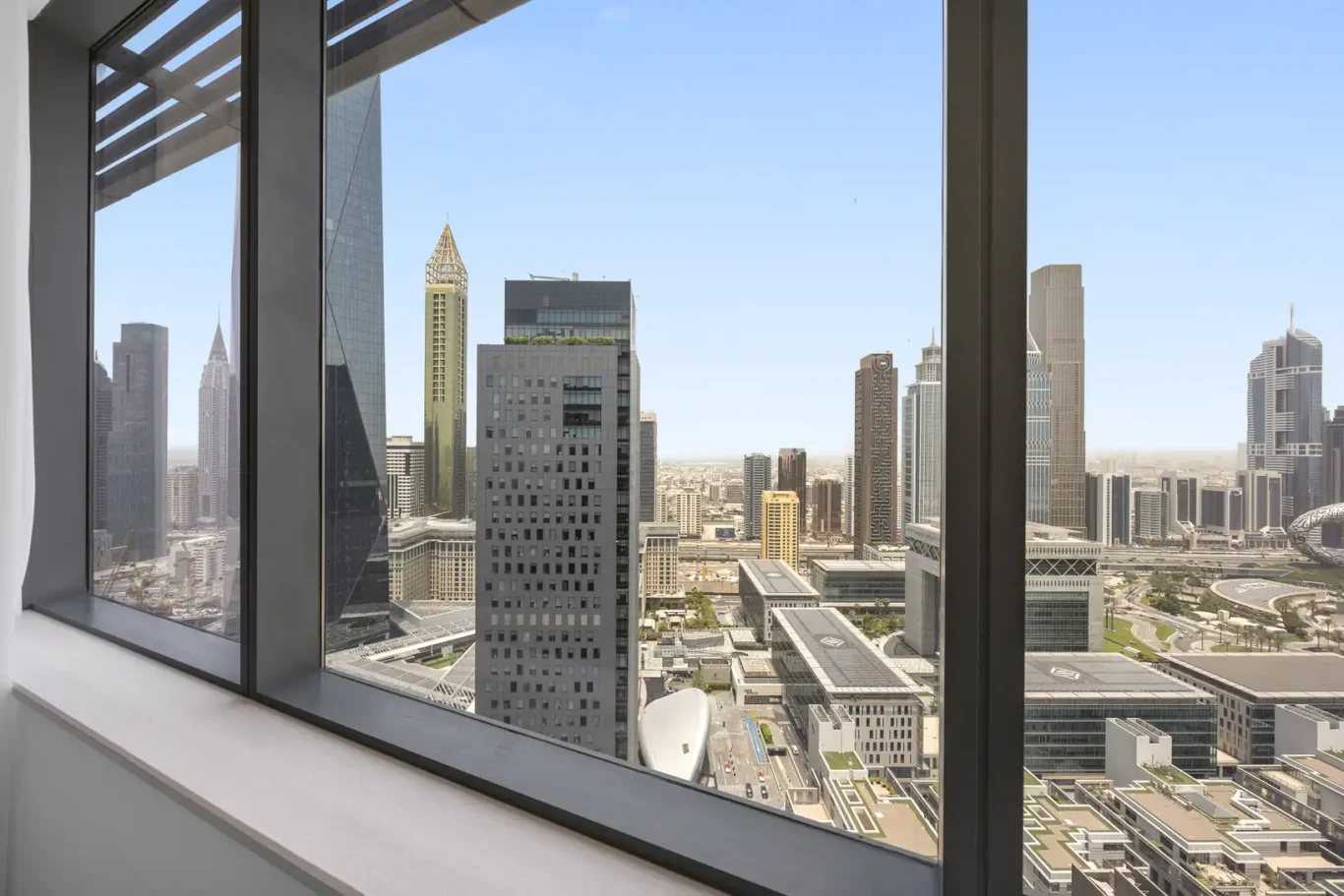 Skyline view through the windows in a Your Stay Apartments one-bedroom at Sky Gardens, DIFC, Dubai.