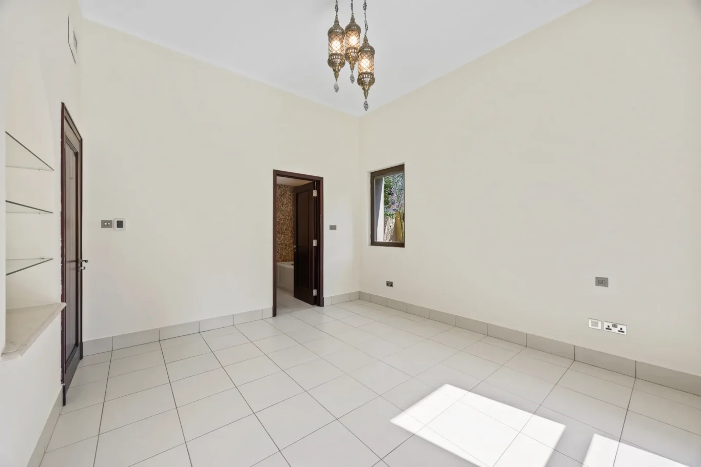 Bedroom overview with tiled floor in an unfurnished two-bedroom garden apartment in Old Town, Downtown Dubai, photographed for ELITE Property Brokerage.