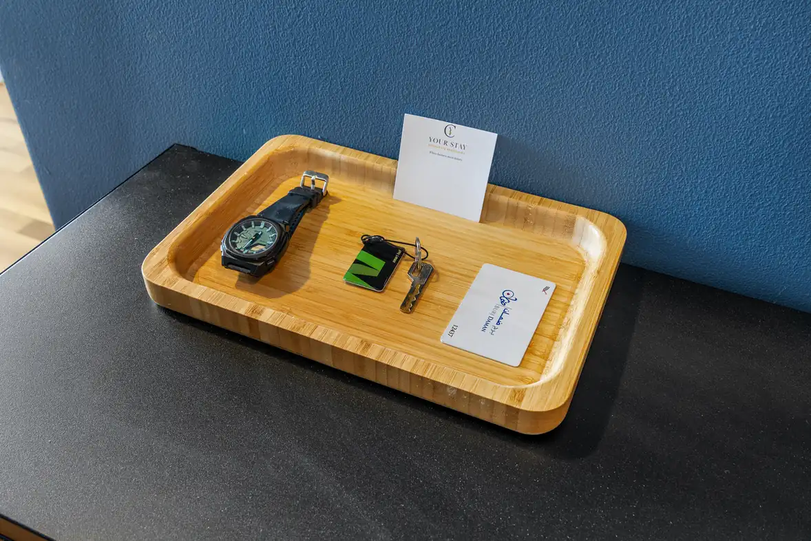 Welcome tray with keys and a guest card in a Your Stay Apartments one-bedroom at Burj Daman, DIFC, Dubai.