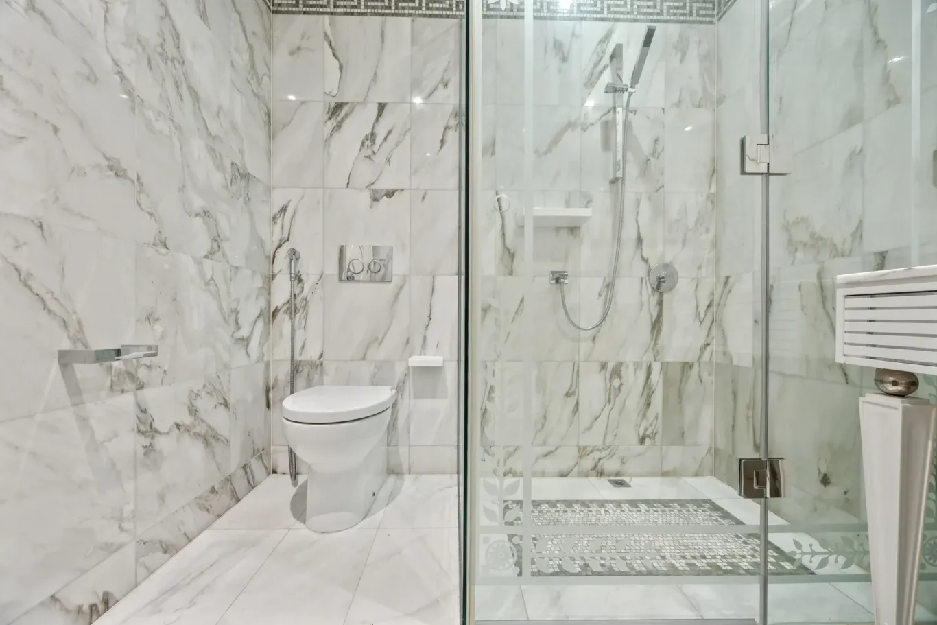 En suite bathroom with WC and walk-in shower in a three-bedroom residence at Palazzo Versace Dubai, Jaddaf Waterfront, photographed for Concierge Auctions.