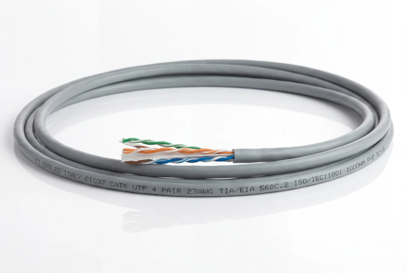 Studio product photo of a coiled grey Cat6 UTP cable with twisted pairs fanned out at the end.