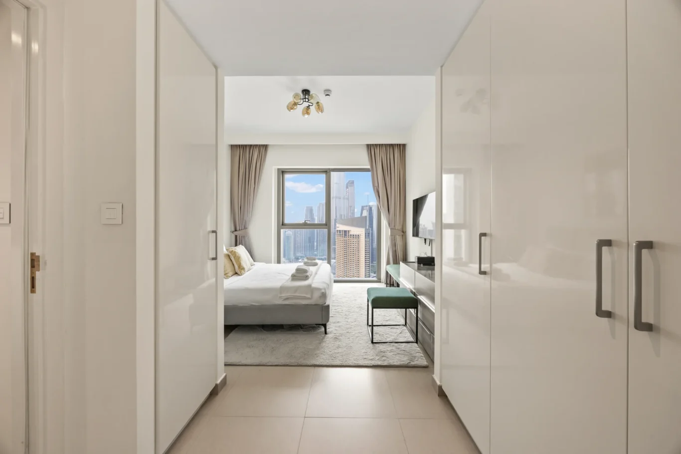 Second bedroom seen from the door with fitted wardrobes. Day, twilight and night Airbnb photography by MRPS for Vista Haus Holiday Homes in Downtown Dubai.
