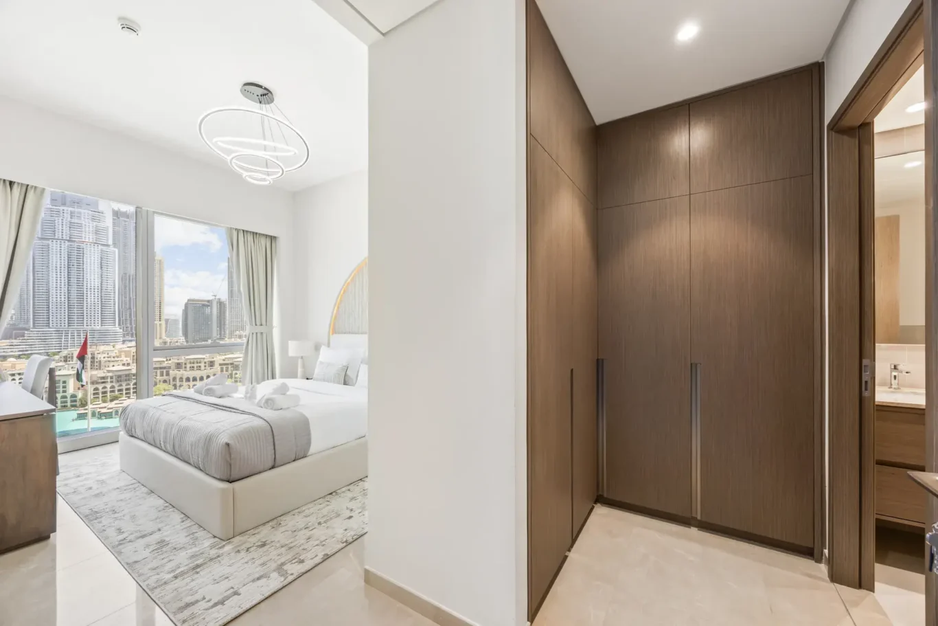 Wardrobe hallway to bedroom in a two-bedroom StayComfy Holiday Homes apartment at Grande Signature, Downtown Dubai.